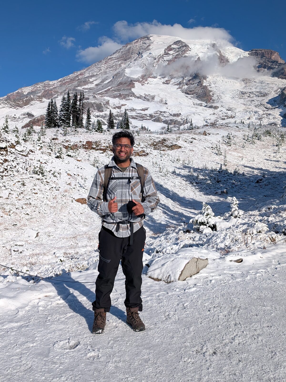 Me hiking in the snow below Mount Rainier